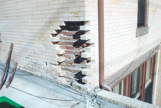 Eroding brick due to water damage, brick replacement to fix during_brick_tear_down_2_jpg