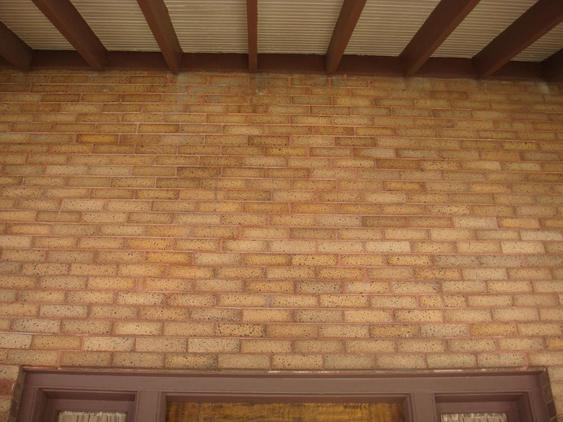 Rebuild Porch Wall, Re-lay Loose Bricks and Stone, Tuckpoint Deteriorating Mortar