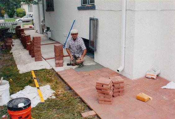 Re-lay Pavers Over Concrete Walkway during_brick_repaving_work_3_jpg