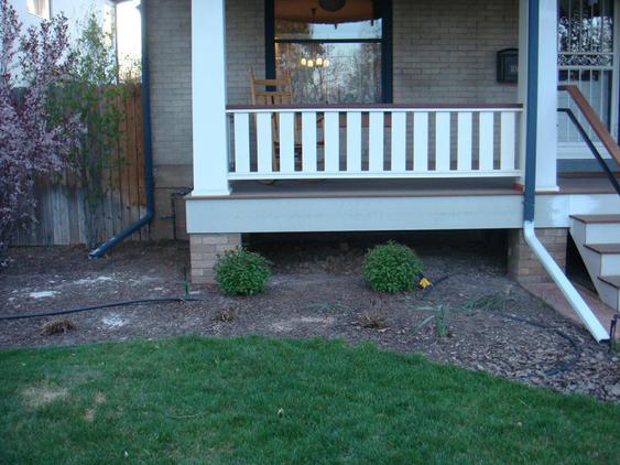 Add Brick on the Bottom of Two Wooden Columns to Match House