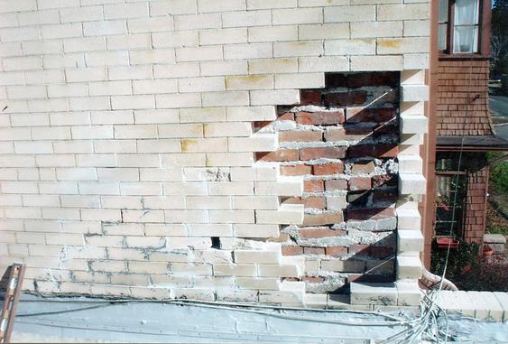 Eroding brick due to water damage, brick replacement to fix during_brick_rebuild_2_jpg