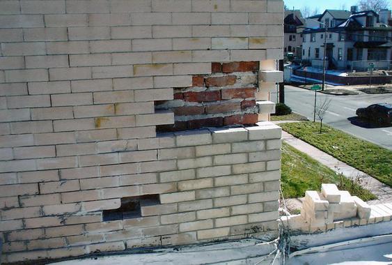 Eroding brick due to water damage, brick replacement to fix during_water_damaged_brick_tear_down_2_jpg