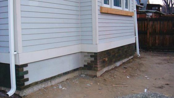 Installing Thin Brick on Back Addition of House during_4_33_jpg