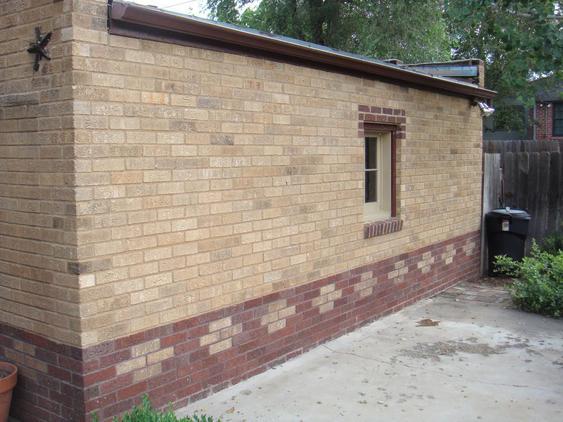 Rebuild Both Courses of Garage Wall to Plumb