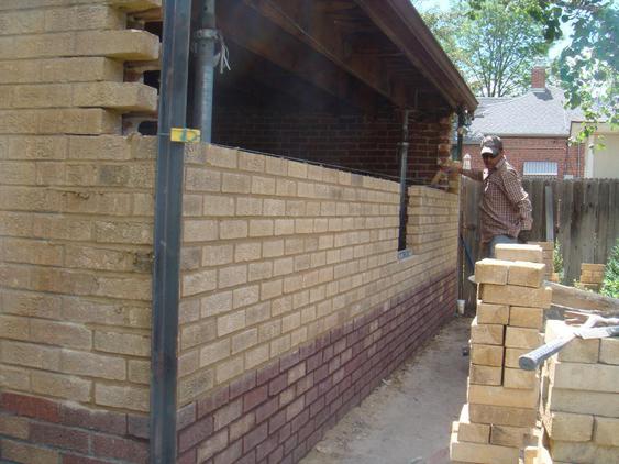 Rebuild Both Courses of Garage Wall to Plumb during_5_25_jpg