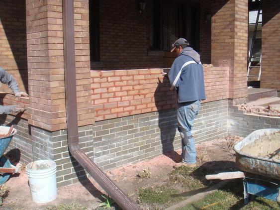 Rebuild Porch Wall, Re-lay Loose Bricks and Stone, Tuckpoint Deteriorating Mortar during_4_24_jpg